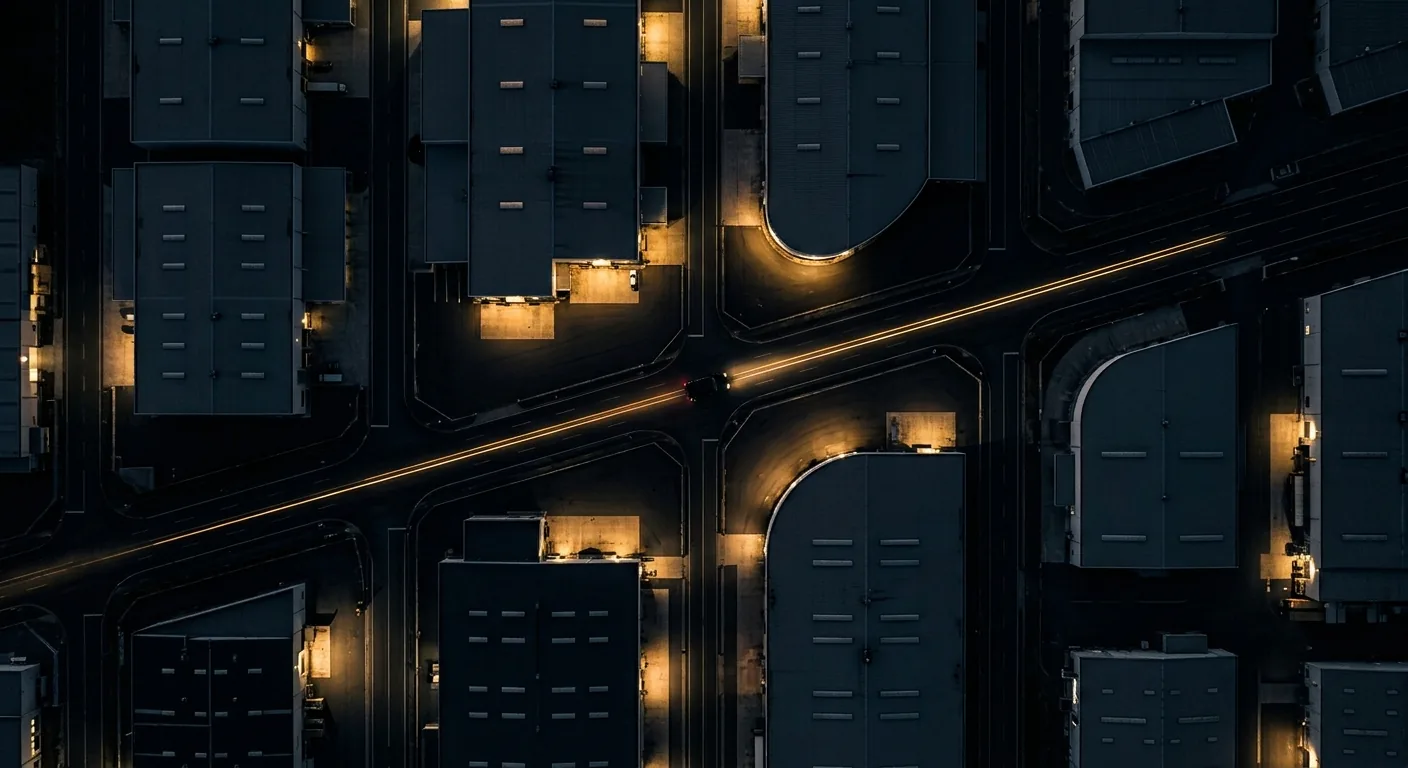 Aerial night view of an industrial facility under patrol